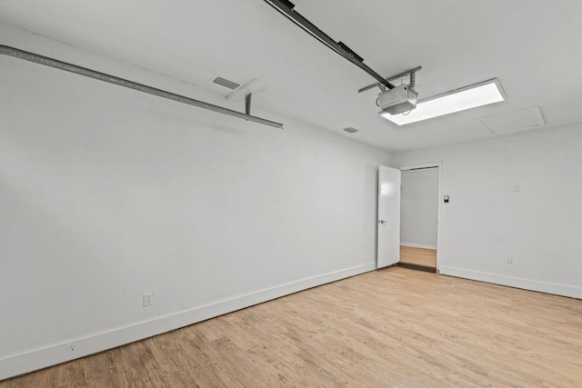 3142 Seattle Slew Ct, Tallahassee, FL 32309 - garage with baseboards and a garage door opener