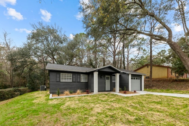 3142 Seattle Slew Ct, Tallahassee, FL 32309 - mid-century home featuring central air condition unit, driveway, a front yard, and an attached garage