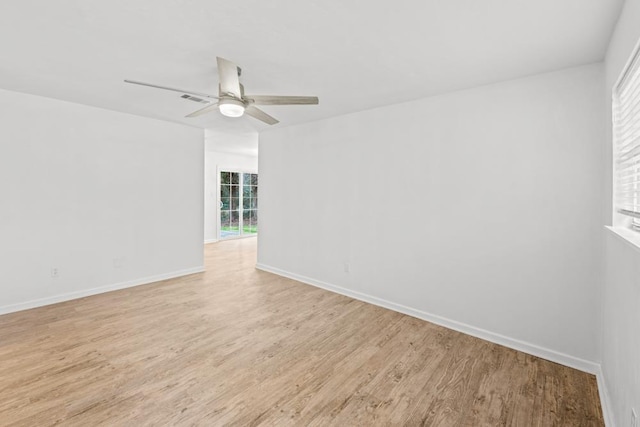 3142 Seattle Slew Ct, Tallahassee, FL 32309 - spare room with light wood-style floors, a ceiling fan, and baseboards