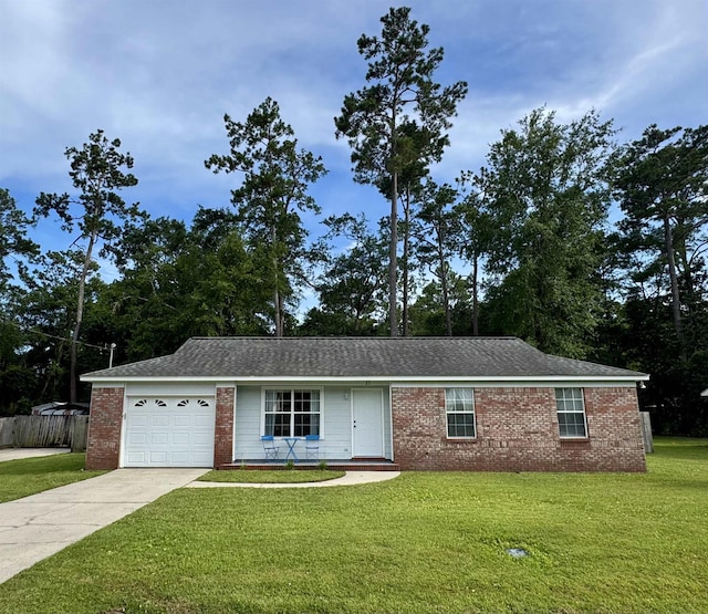 27 Pirates Cove Ln, Saint Marks, FL 32355 - ranch-style house featuring a garage, driveway, and brick siding