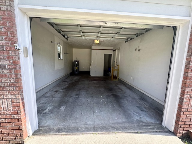 27 Pirates Cove Ln, Saint Marks, FL 32355 - garage featuring electric water heater and a garage door opener