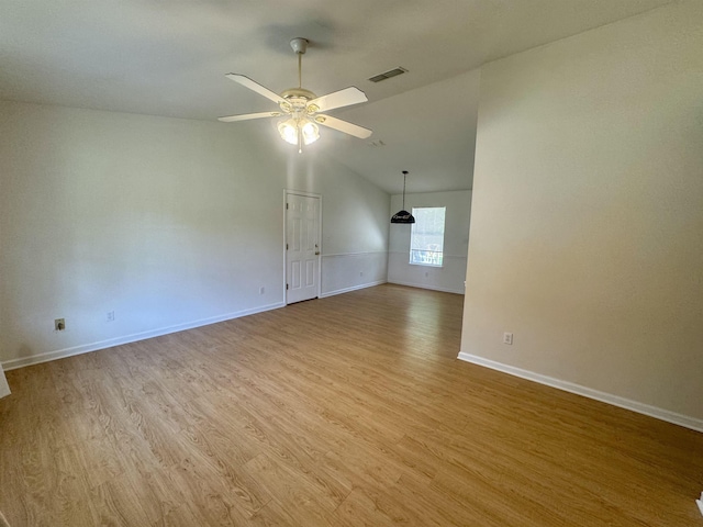 27 Pirates Cove Ln, Saint Marks, FL 32355 - spare room featuring ceiling fan, light wood-style floors, and vaulted ceiling