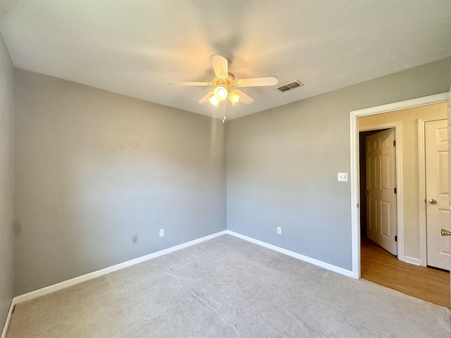 27 Pirates Cove Ln, Saint Marks, FL 32355 - carpeted spare room featuring ceiling fan and baseboards