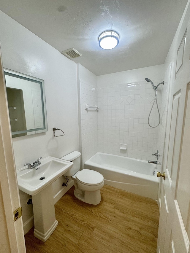 27 Pirates Cove Ln, Saint Marks, FL 32355 - bathroom featuring wood finished floors and shower / washtub combination