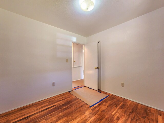 spare room featuring hardwood / wood-style flooring