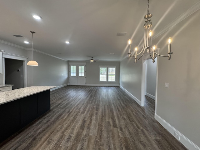 unfurnished living room with ornamental molding, dark wood-style flooring, and baseboards