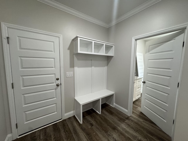 mudroom with dark wood-style floors, ornamental molding, and baseboards