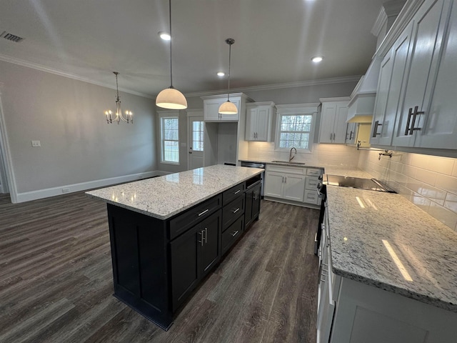 kitchen featuring decorative backsplash, dark wood-style flooring, and crown molding