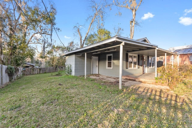 450 W Dogwood St, Monticello, FL 32344 - rear view of property featuring a fenced backyard and a yard