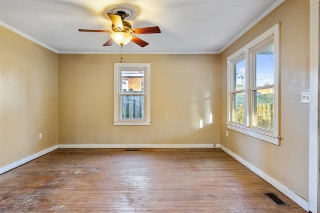 450 W Dogwood St, Monticello, FL 32344 - unfurnished room featuring hardwood / wood-style floors, visible vents, a wealth of natural light, and crown molding