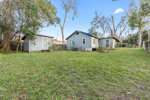 450 W Dogwood St, Monticello, FL 32344 - view of yard featuring an outbuilding, fence, and a shed