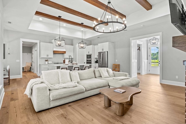 1020 Baum Rd, Tallahassee, FL 32317 - living room featuring a chandelier, beam ceiling, light wood-style flooring, recessed lighting, and a tray ceiling