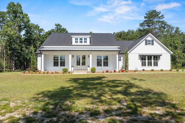 1020 Baum Rd, Tallahassee, FL 32317 - view of front of home with a front yard, french doors, and board and batten siding