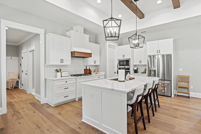 1020 Baum Rd, Tallahassee, FL 32317 - kitchen with appliances with stainless steel finishes, custom exhaust hood, backsplash, a breakfast bar, and white cabinets
