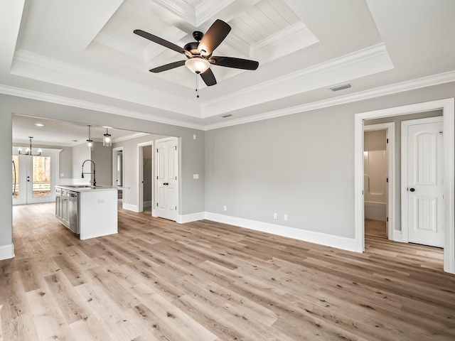 57 Mohawk Trl, Crawfordville, FL 32327 - unfurnished living room with light wood-type flooring, a raised ceiling, visible vents, and a sink