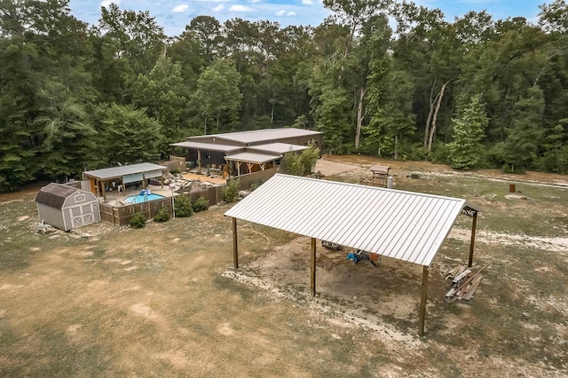 view of property's community with a shed