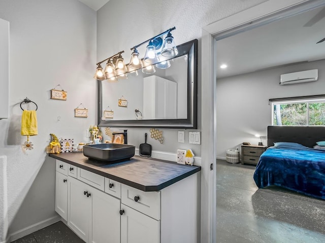 bathroom featuring vanity and an AC wall unit