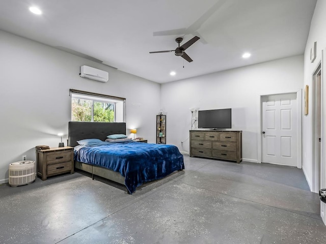 bedroom with ceiling fan, a wall unit AC, and concrete floors