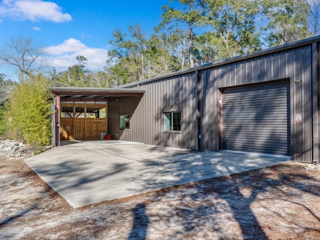 view of side of property featuring an outbuilding and a garage