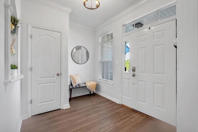 entrance foyer with hardwood / wood-style floors and ornamental molding