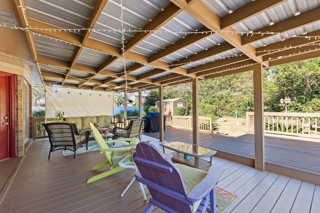 wooden deck featuring area for grilling and outdoor lounge area