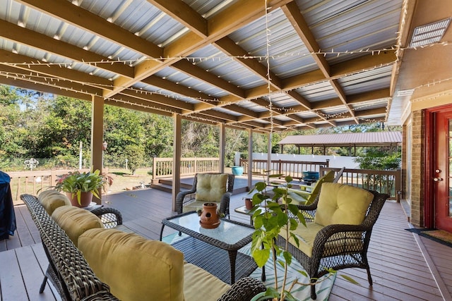 wooden terrace featuring an outdoor living space