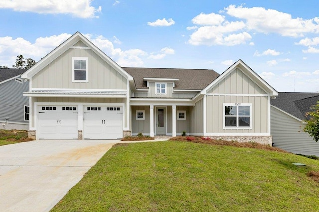 craftsman-style home with a garage and a front yard