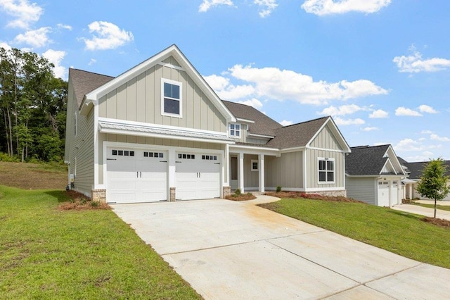 craftsman-style house with a garage and a front yard