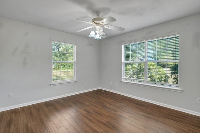 spare room with ceiling fan and dark hardwood / wood-style floors