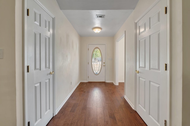 entryway with dark wood-type flooring