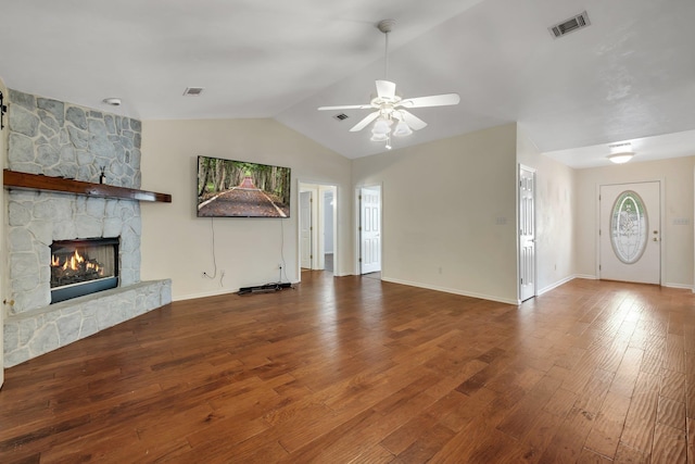 unfurnished living room with a fireplace, lofted ceiling, hardwood / wood-style floors, and ceiling fan