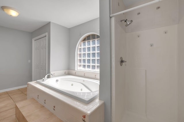 bathroom featuring tile patterned floors and plus walk in shower