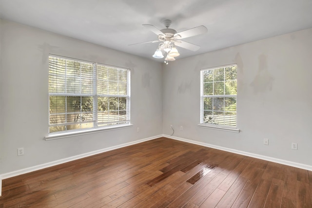 spare room featuring hardwood / wood-style floors and ceiling fan