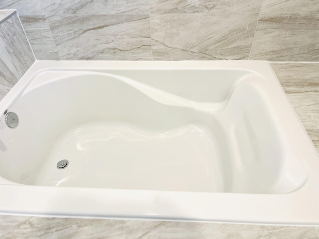 full bath featuring a bath