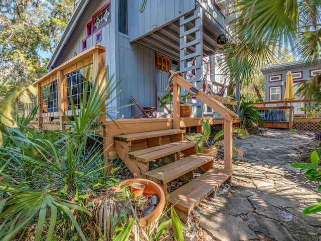 back of house featuring a deck