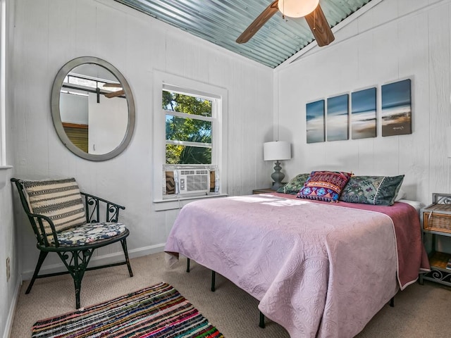 carpeted bedroom featuring ceiling fan and lofted ceiling