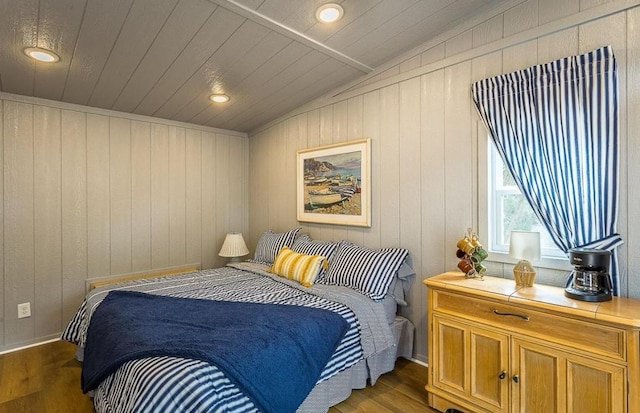 bedroom featuring dark hardwood / wood-style floors, vaulted ceiling, wooden ceiling, and wood walls