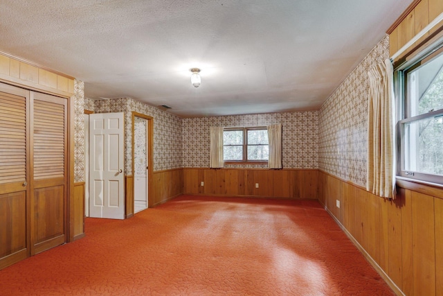 interior space featuring plenty of natural light and a textured ceiling