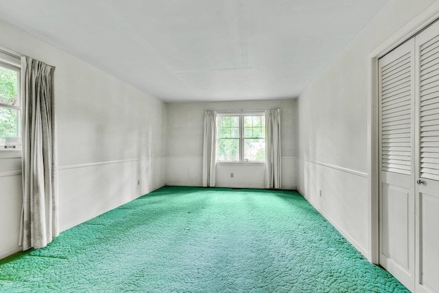 unfurnished room with carpet flooring