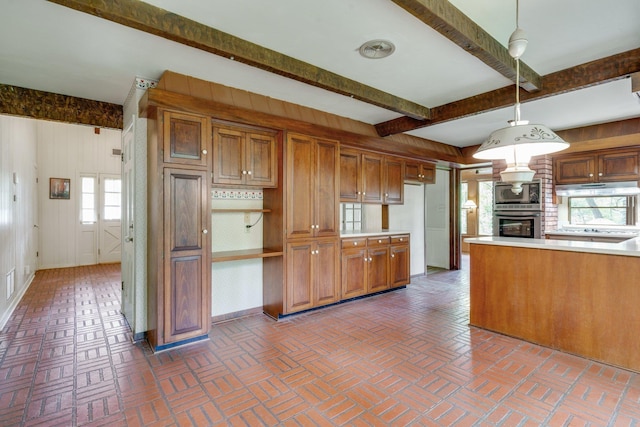 kitchen with decorative light fixtures, wooden walls, stainless steel appliances, and beamed ceiling