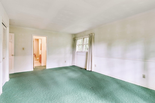 view of carpeted spare room