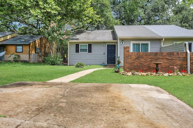 1600 Misty Garden Way, Tallahassee, FL 32303 - ranch-style home with a shingled roof and an outbuilding