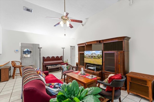 living room with high vaulted ceiling, ceiling fan, and light tile patterned flooring