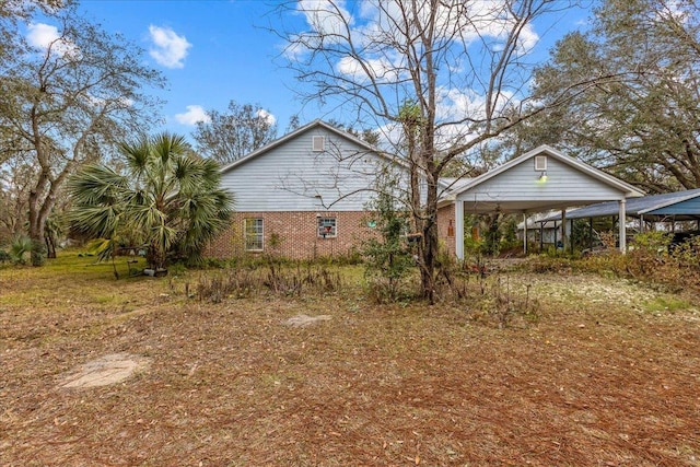 view of home's exterior with a carport