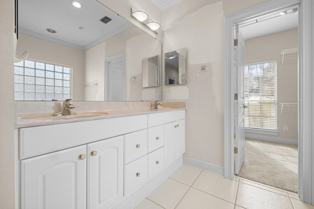 bathroom with vanity, crown molding, and tile patterned floors