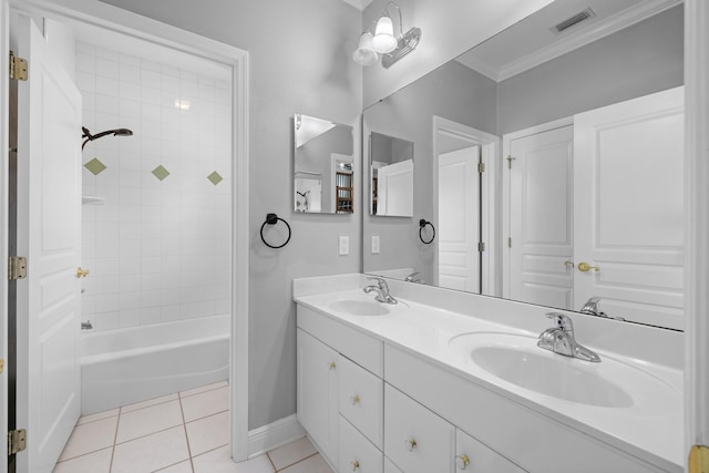 bathroom with vanity, tiled shower / bath combo, tile patterned flooring, and crown molding