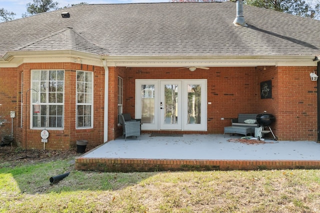 rear view of property featuring a patio area and ceiling fan