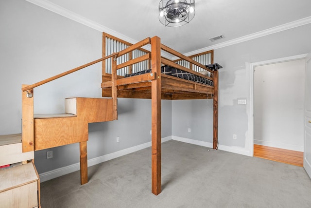 unfurnished bedroom featuring light colored carpet and ornamental molding