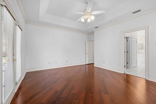 unfurnished bedroom featuring ceiling fan, light hardwood / wood-style floors, crown molding, and a raised ceiling