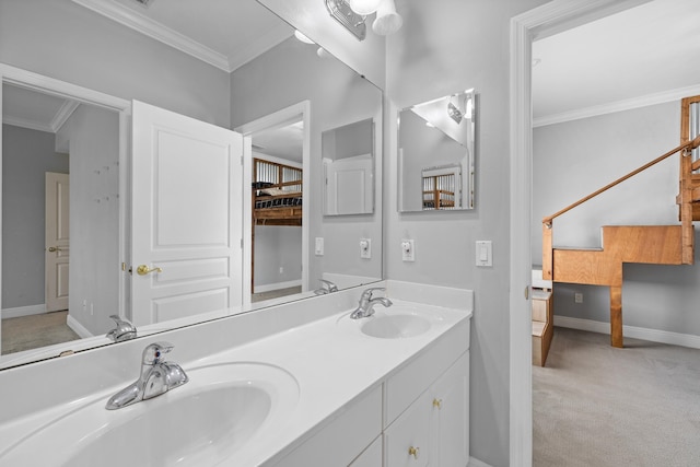 bathroom with ornamental molding and vanity